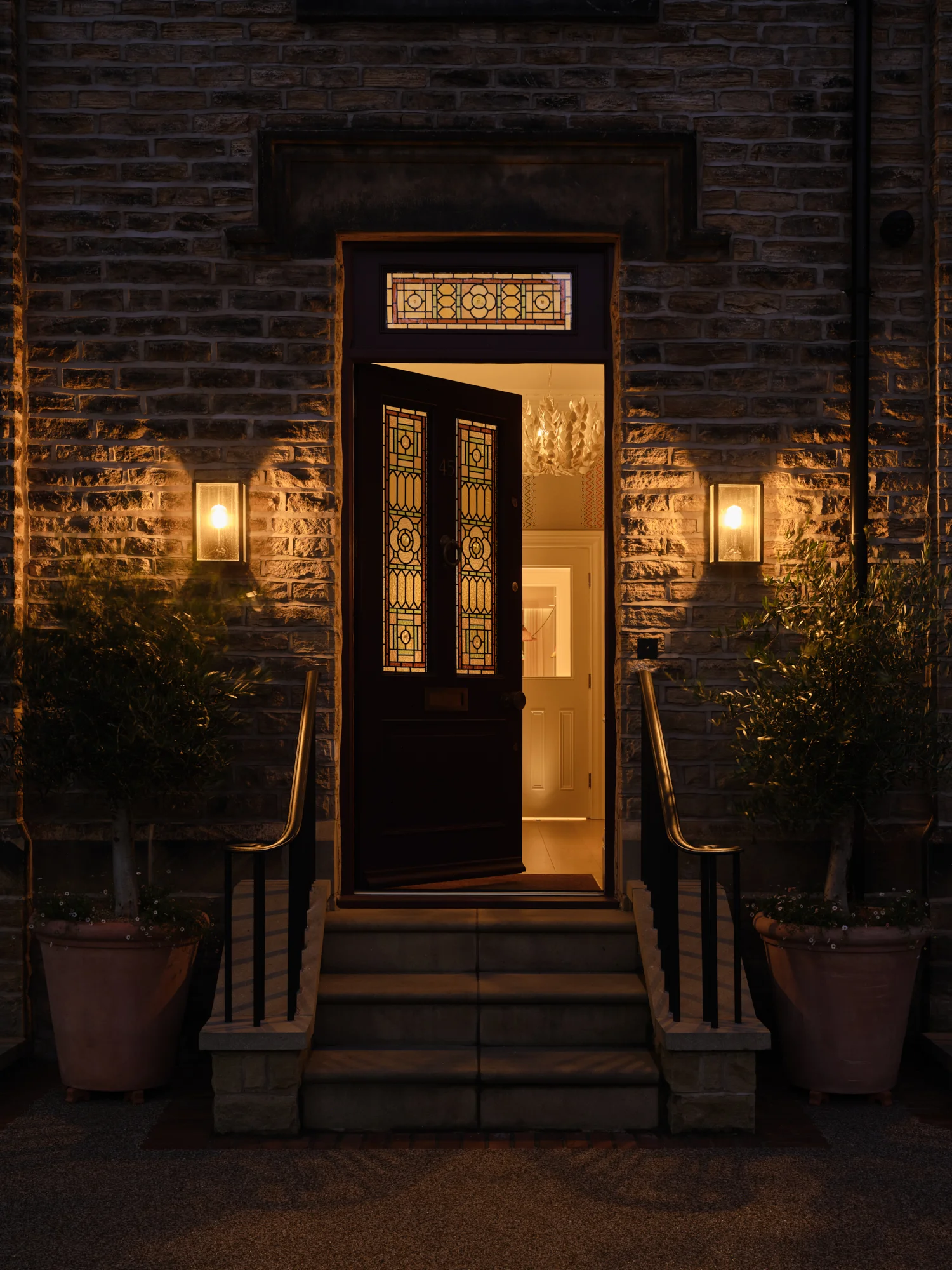 Front exterior of Sheffield period home with custom curved metal handrails and painted front door designed by Wilding 