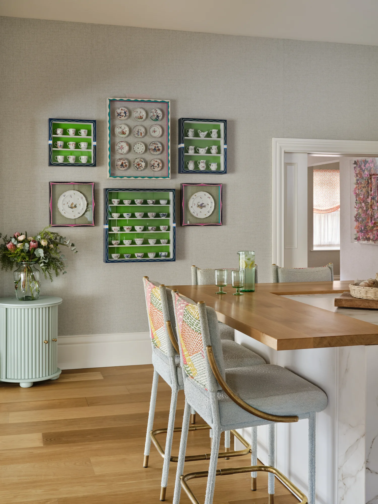 Family owned antique crockery framed and displayed in hand painted frames to compliment the space curated by luxury interior design studio Wilding 