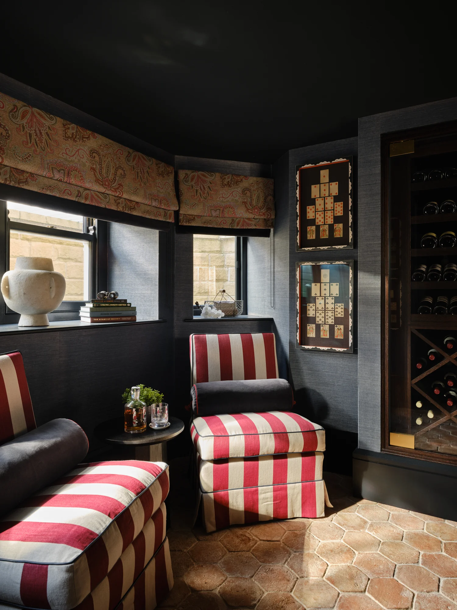 Luxurious wine room with bespoke joinery and furniture pieces including a wall to wall wine cooler and humidor designed by Wilding 