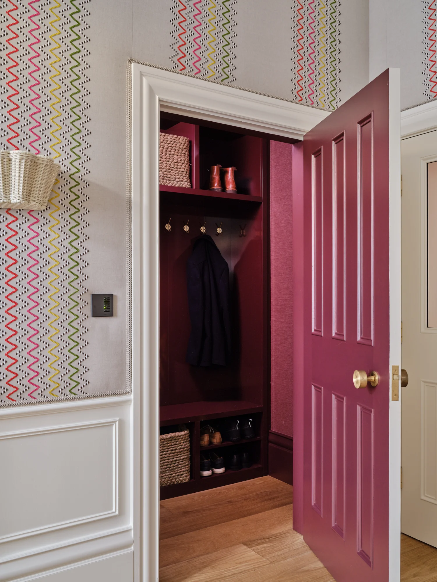 Entrance hallway with recreated period panelling detail and fabric lined walls in a Sheffield home by luxury interior designer Wilding 